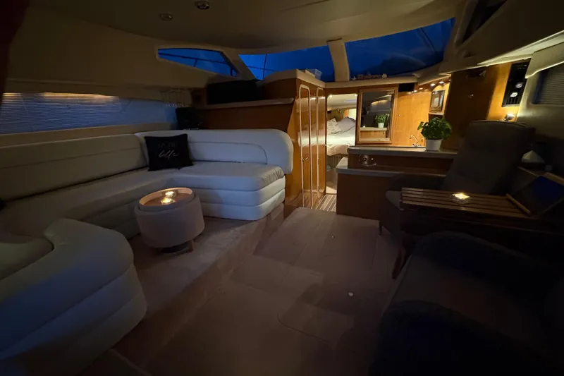  Yacht Photos Pics Luxurious interior of 2003 Regal Commodore 3880 yacht with cozy seating and ambient lighting.