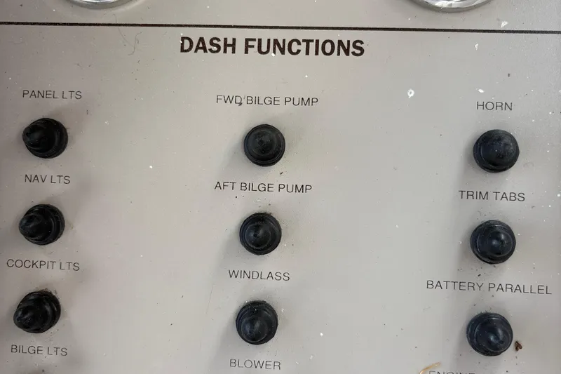  Yacht Photos Pics Dashboard controls of a 2003 Regal Commodore 3880 boat, featuring various function switches.