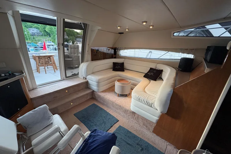  Yacht Photos Pics Luxurious interior of 2003 Regal Commodore 3880 yacht with plush seating and elegant decor.