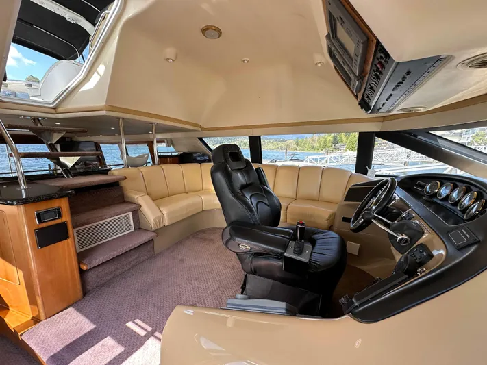  Yacht Photos Pics Luxurious interior of 2001 Carver 570 Voyager Pilothouse with leather seating and modern controls.