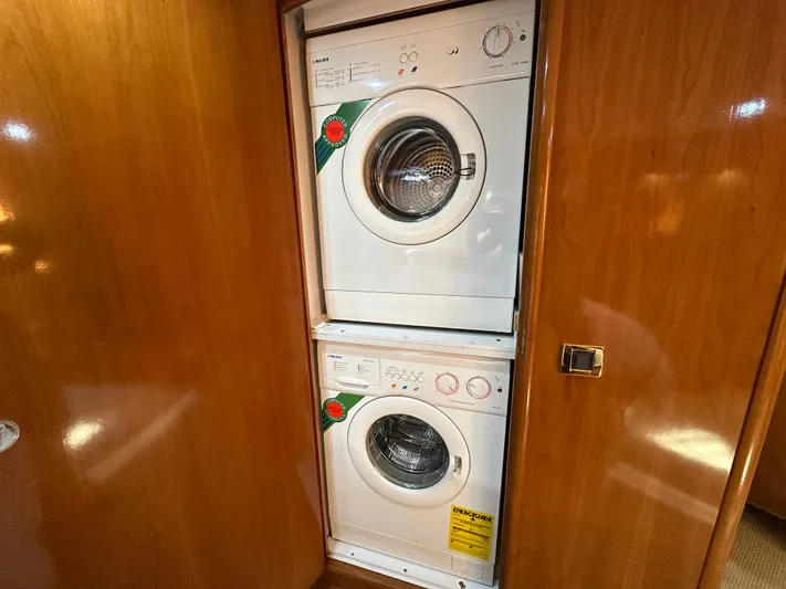  Yacht Photos Pics Stacked washer and dryer in 2001 Carver 570 Voyager Pilothouse yacht interior.