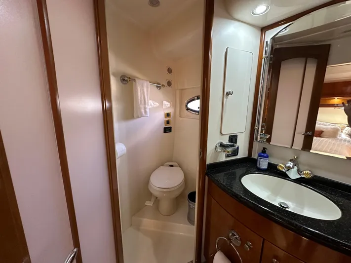  Yacht Photos Pics Luxurious bathroom in 2001 Carver 570 Voyager Pilothouse yacht, featuring modern amenities and elegant design.