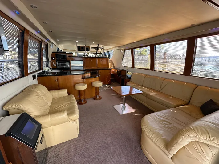  Yacht Photos Pics Luxurious interior of 2001 Carver 570 Voyager Pilothouse yacht with leather seating and modern amenities.