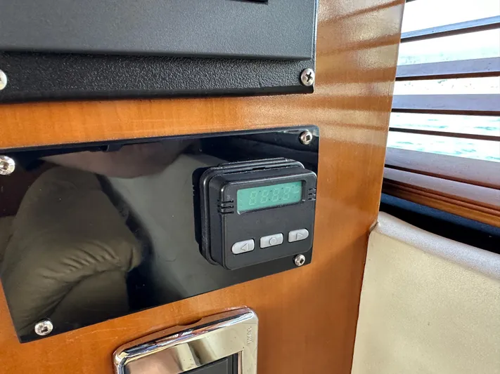  Yacht Photos Pics Control panel inside 2001 Carver 570 Voyager Pilothouse with digital display and buttons.