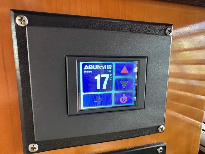  Yacht Photos Pics Aqua-Air control panel on 2001 Carver 570 Voyager Pilothouse, displaying 17°C temperature setting.