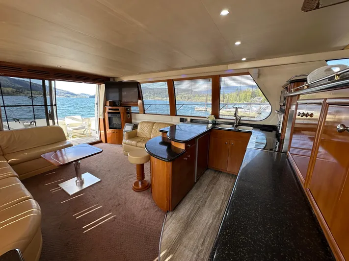  Yacht Photos Pics Luxurious interior of 2001 Carver 570 Voyager Pilothouse yacht with elegant furnishings and scenic views.