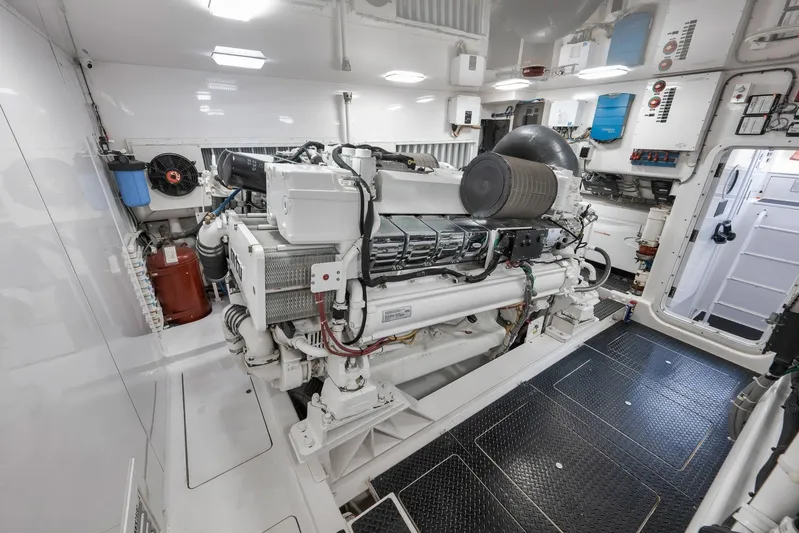 Monkey Business Yacht Photos Pics Engine room of 2010 Viking 82 Convertible yacht, showcasing advanced marine machinery.