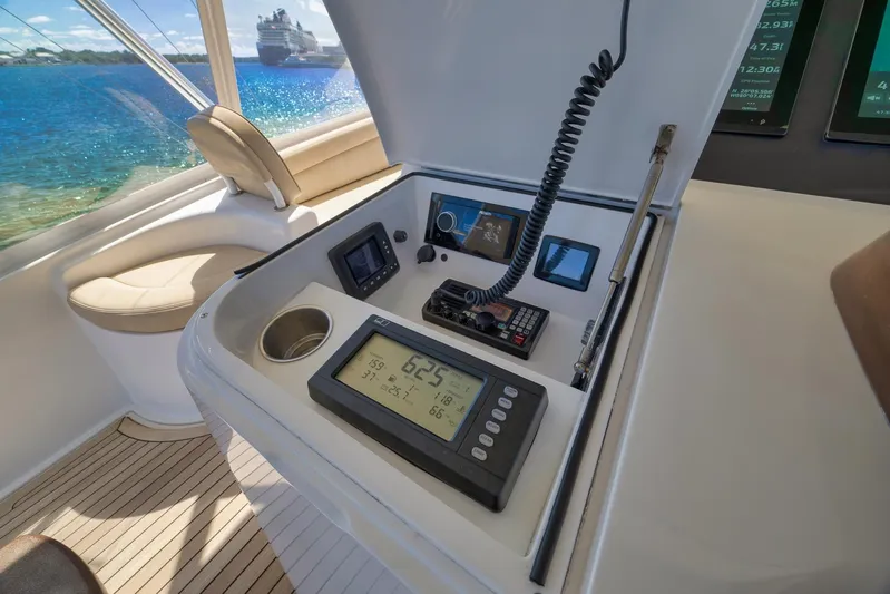 Monkey Business Yacht Photos Pics Control panel of a 2010 Viking 82 Convertible yacht with ocean view.