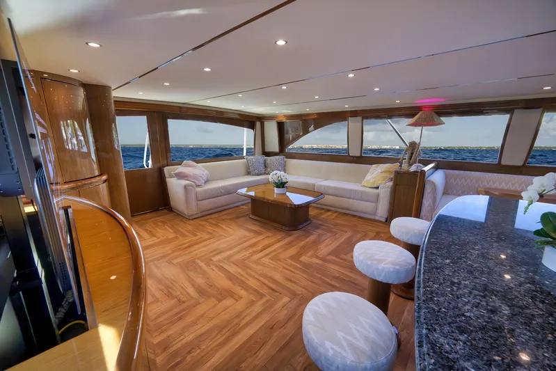 Monkey Business Yacht Photos Pics Luxurious interior of 2010 Viking 82 Convertible yacht with elegant seating and ocean view.