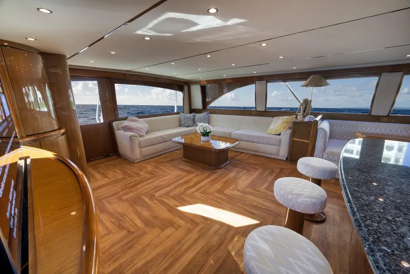 Monkey Business Yacht Photos Pics Luxurious interior of 2010 Viking 82 Convertible yacht with elegant seating and ocean views.