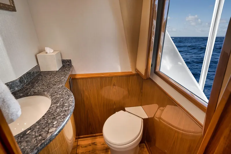 Monkey Business Yacht Photos Pics Luxurious bathroom on 2010 Viking 82 Convertible yacht with ocean view.