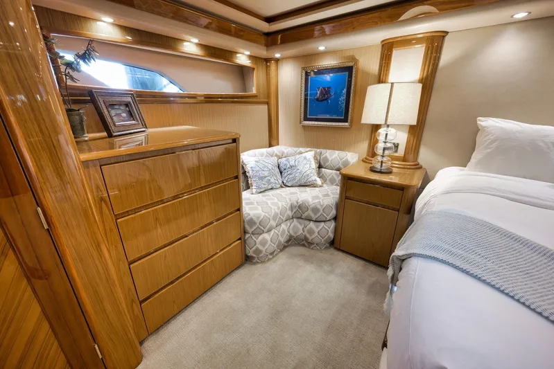 Monkey Business Yacht Photos Pics Luxurious interior of 2010 Viking 82 Convertible yacht with elegant wood finishes.