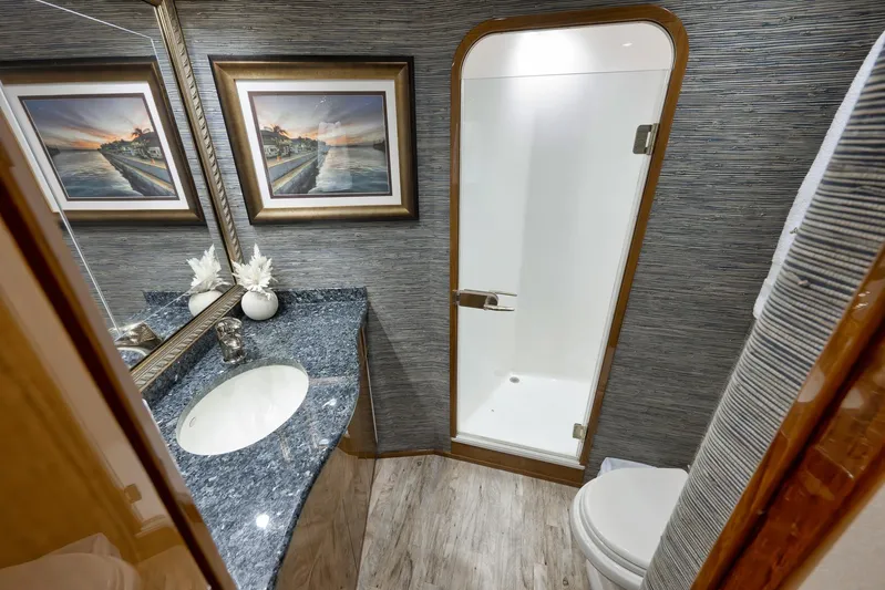 Monkey Business Yacht Photos Pics Luxurious bathroom in 2010 Viking 82 Convertible yacht with elegant decor and modern amenities.