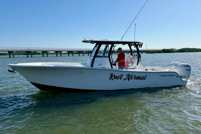  Yacht Photos Pics 2024 Sportsman Open 282TE Center Console boat on water, side view.