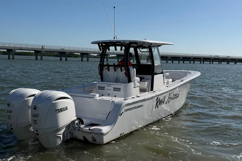  Yacht Photos Pics 2024 Sportsman Open 282TE Center Console boat with twin Yamaha engines on water.