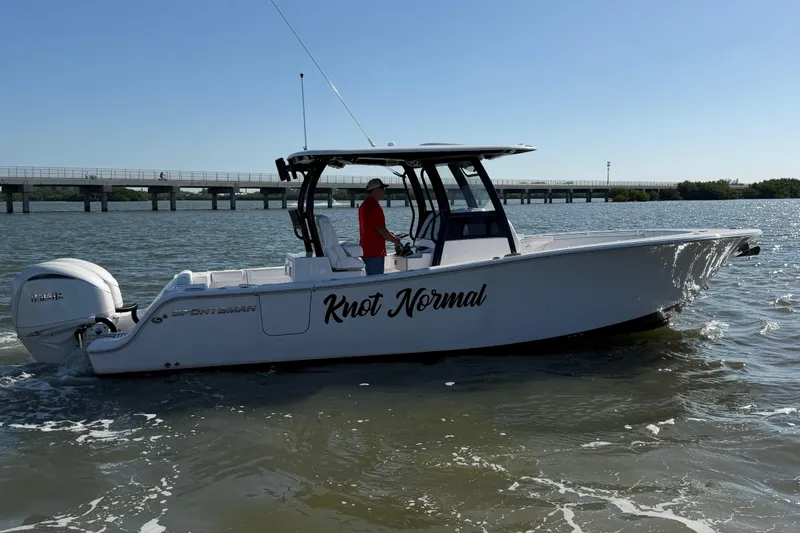 Yacht Photos Pics 2024 Sportsman Open 282TE Center Console boat on water, side view, with "Knot Normal" text.