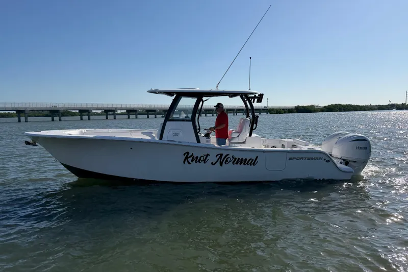  Yacht Photos Pics 2024 Sportsman Open 282TE Center Console boat on water, side view.