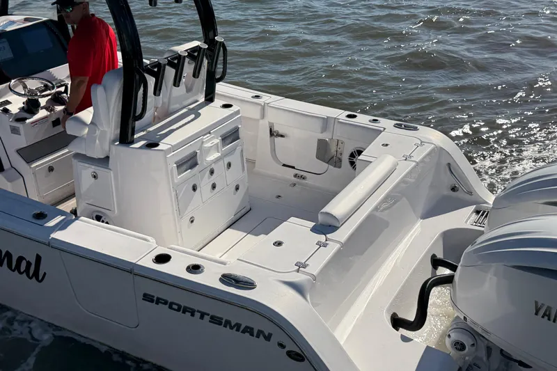  Yacht Photos Pics 2024 Sportsman Open 282TE Center Console boat on water, featuring spacious deck and seating.