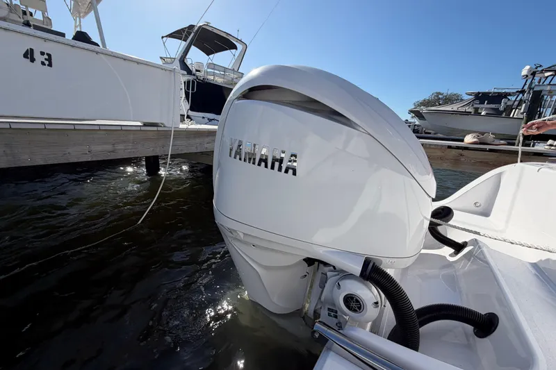  Yacht Photos Pics 2024 Sportsman Open 282TE Center Console with Yamaha outboard engine at dock.