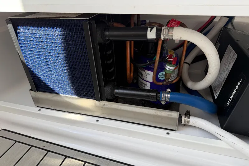  Yacht Photos Pics 2024 Sportsman Open 282TE Center Console boat's internal cooling system components.