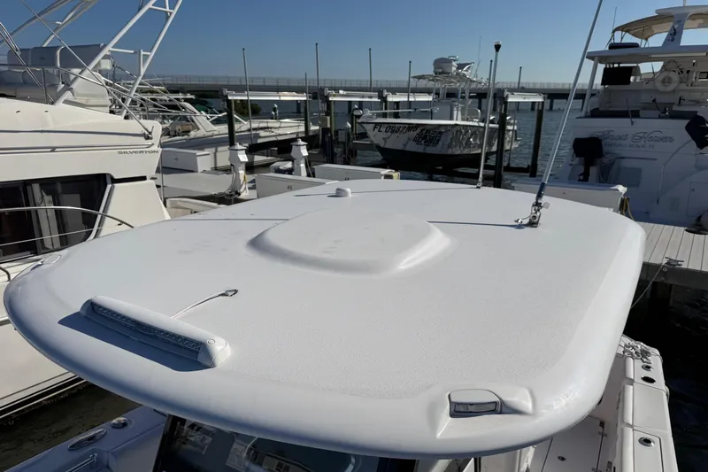  Yacht Photos Pics 2024 Sportsman Open 282TE Center Console boat docked at marina.