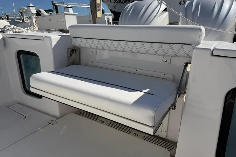  Yacht Photos Pics 2024 Sportsman Open 282TE Center Console with foldable white bench seat.