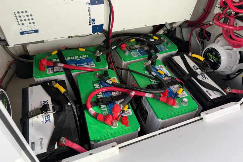  Yacht Photos Pics 2024 Sportsman Open 282TE Center Console battery compartment with multiple batteries and wiring.