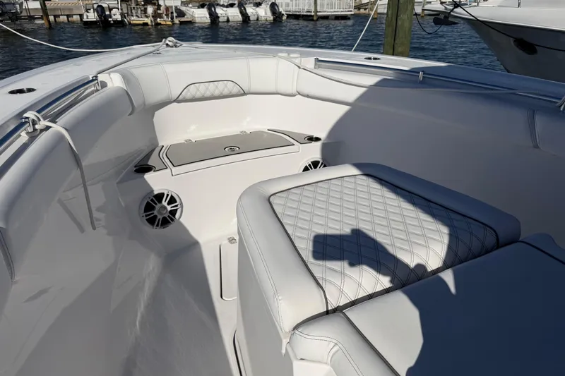  Yacht Photos Pics 2024 Sportsman Open 282TE Center Console boat interior with cushioned seating and speakers.