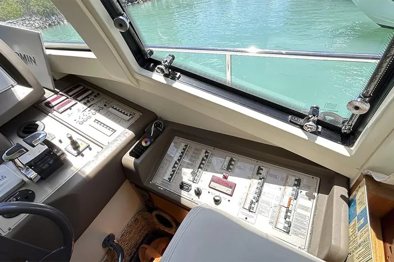2008 Ferretti 510 Fly @ Cancun Yacht Photos Pics Control panel of a 2008 Ferretti Yachts 510, overlooking turquoise water.