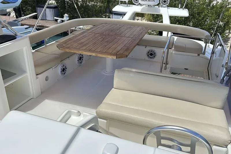 2008 Ferretti 510 Fly @ Cancun Yacht Photos Pics Luxurious 2008 Ferretti Yachts 510 flybridge with seating and wooden table.