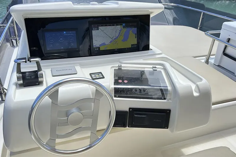 2008 Ferretti 510 Fly @ Cancun Yacht Photos Pics 2008 Ferretti Yachts 510 helm with Garmin navigation system and modern controls.