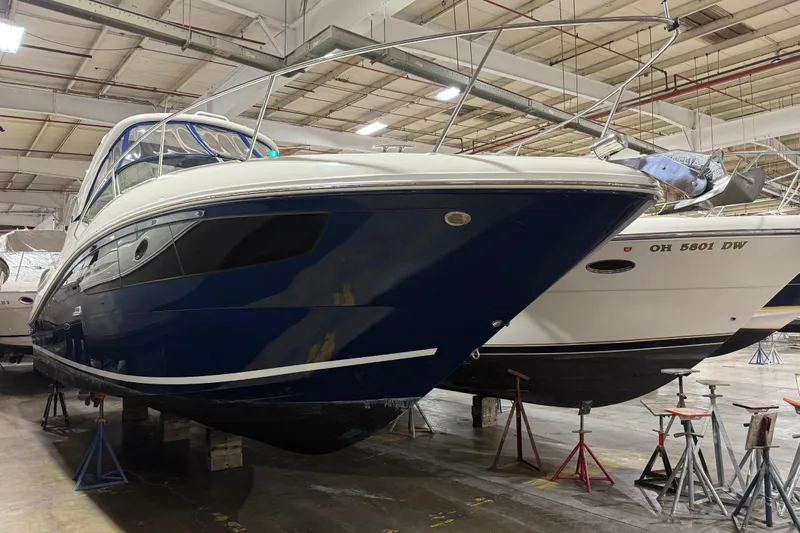  Yacht Photos Pics 2017 Sea Ray Sundancer 330 yacht in indoor storage, elevated on stands.
