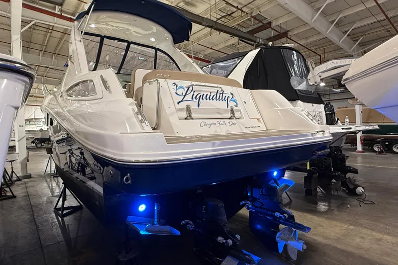  Yacht Photos Pics 2017 Sea Ray Sundancer 330 yacht in a warehouse, featuring blue underwater lights.