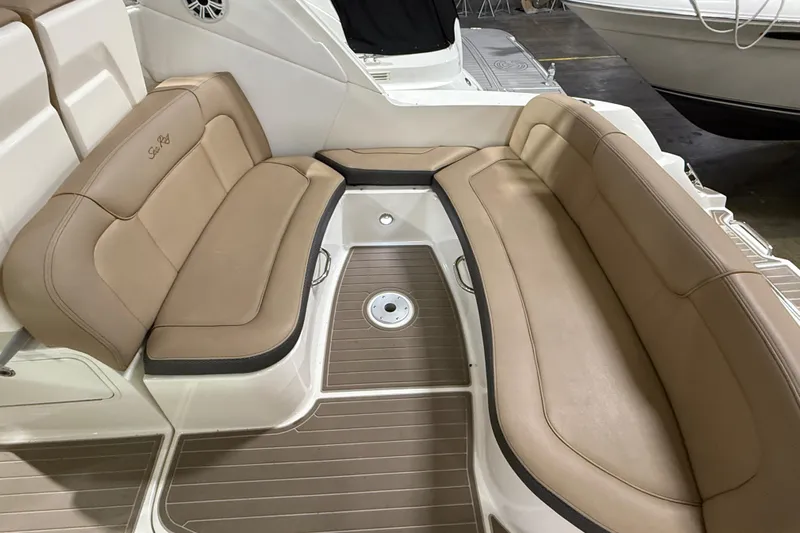  Yacht Photos Pics 2017 Sea Ray Sundancer 330 boat interior with tan seating and wood flooring.