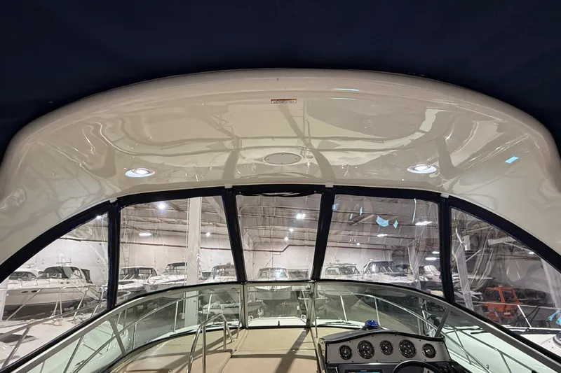  Yacht Photos Pics 2017 Sea Ray Sundancer 330 interior view with dashboard and windows in a showroom.