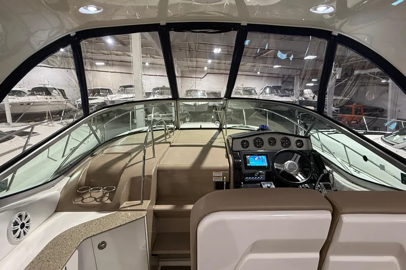  Yacht Photos Pics 2017 Sea Ray Sundancer 330 cockpit with modern navigation system and luxurious seating.