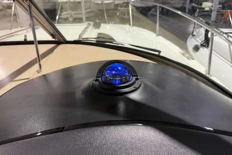  Yacht Photos Pics Compass on 2017 Sea Ray Sundancer 330 dashboard, showcasing navigation equipment.