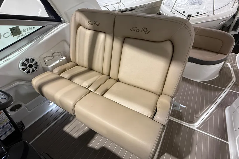  Yacht Photos Pics Luxurious seating on 2017 Sea Ray Sundancer 330 yacht, featuring beige upholstery and cup holders.