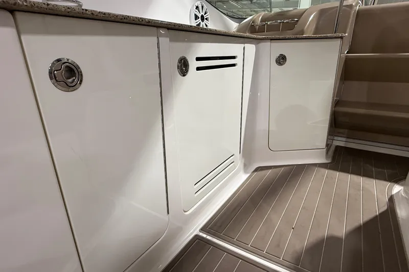  Yacht Photos Pics 2017 Sea Ray Sundancer 330 interior with sleek cabinetry and wood flooring.