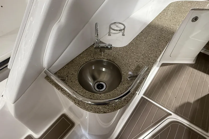  Yacht Photos Pics 2017 Sea Ray Sundancer 330 boat sink with granite countertop and stainless steel faucet.