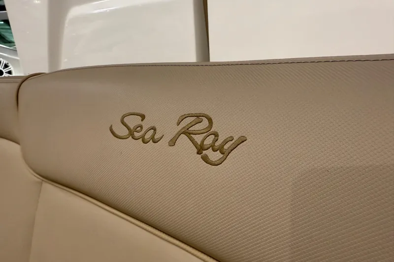  Yacht Photos Pics Beige interior of 2017 Sea Ray Sundancer 330 with embroidered logo.