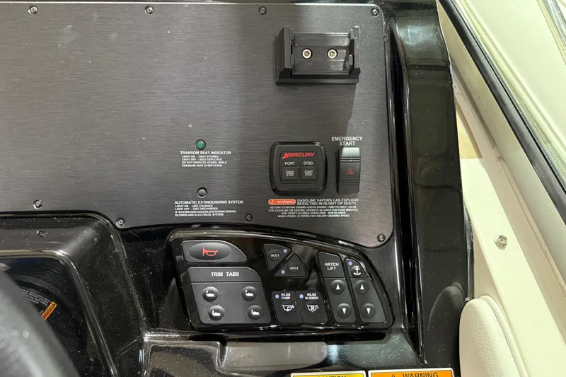  Yacht Photos Pics Control panel of a 2017 Sea Ray Sundancer 330 boat with various switches and indicators.