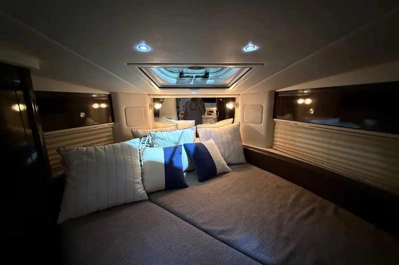  Yacht Photos Pics Luxurious cabin interior of 2017 Sea Ray Sundancer 330 yacht with plush bedding.