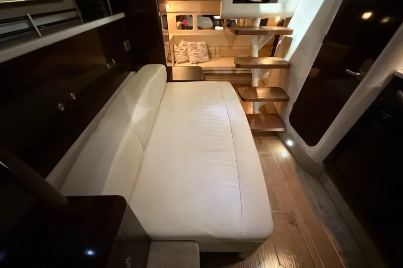  Yacht Photos Pics Interior of 2017 Sea Ray Sundancer 330 yacht with cozy seating and wooden steps.