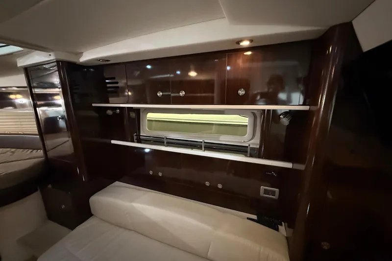 Yacht Photos Pics Luxurious interior of 2017 Sea Ray Sundancer 330 yacht with wood paneling and seating.