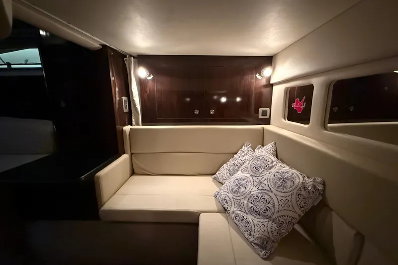  Yacht Photos Pics Luxurious interior of 2017 Sea Ray Sundancer 330 yacht with plush seating and decorative pillows.