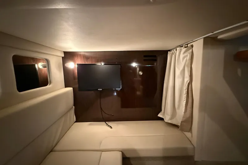  Yacht Photos Pics Interior cabin of 2017 Sea Ray Sundancer 330 with TV and seating area.