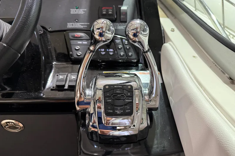  Yacht Photos Pics Control panel of a 2017 Sea Ray Sundancer 330 boat with chrome throttle levers.