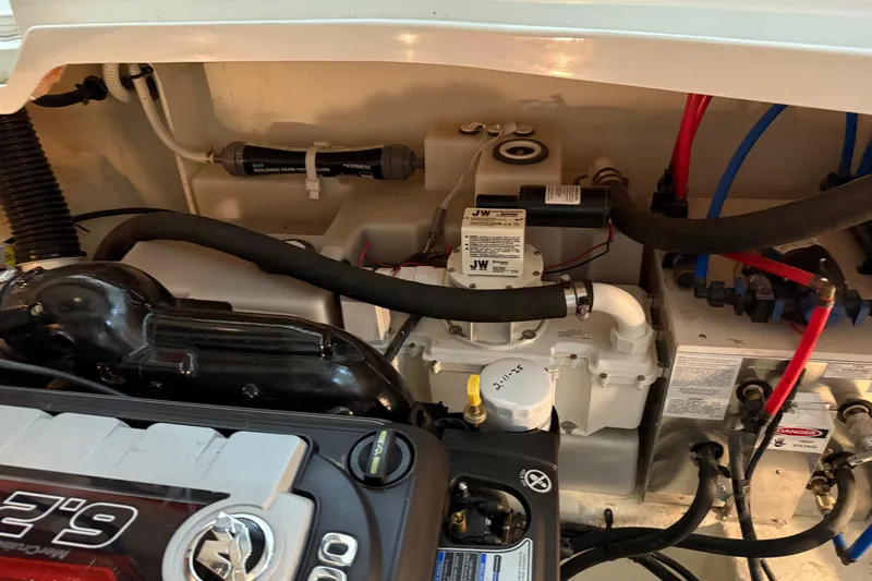  Yacht Photos Pics Engine compartment of a 2017 Sea Ray Sundancer 330 boat, showcasing mechanical components.