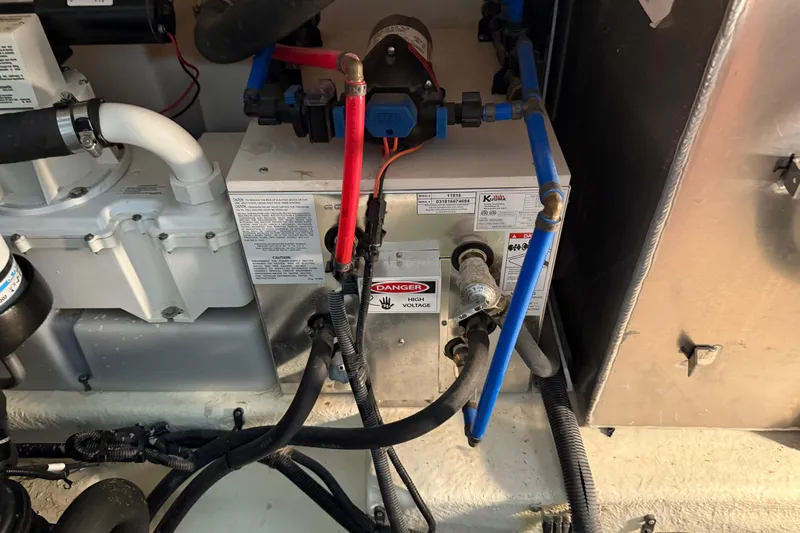  Yacht Photos Pics Engine compartment of a 2017 Sea Ray Sundancer 330 with electrical and plumbing components.